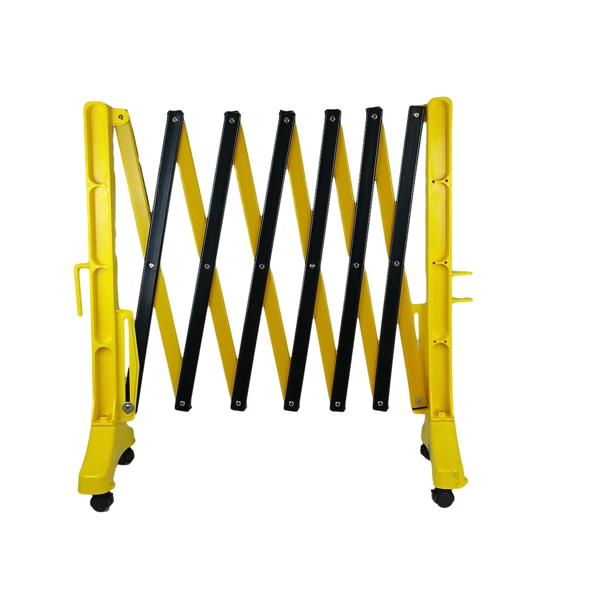 A flat-packed, detachable yellow and black expandable barrier with visible castors and brakes.