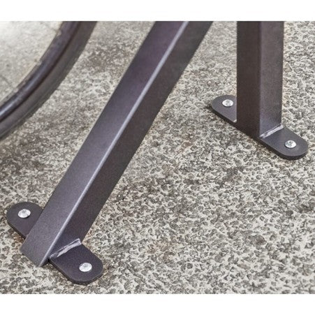 Metal brackets on a concrete surface